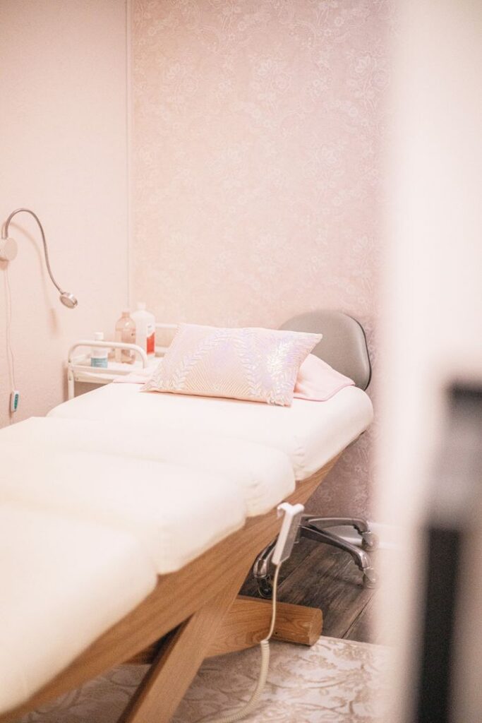 Elegant spa room in Brevard, North Carolina featuring minimalist decor with soft pink tones.